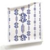 Charlie Sapphire blue and white striped wallpaper with flowers_a white artisan wallpaper_Pearl and Maude. A roll of Charlie, Pearl & Maude's blue and white floral striped wallpaper has a vintage wallpaper motif