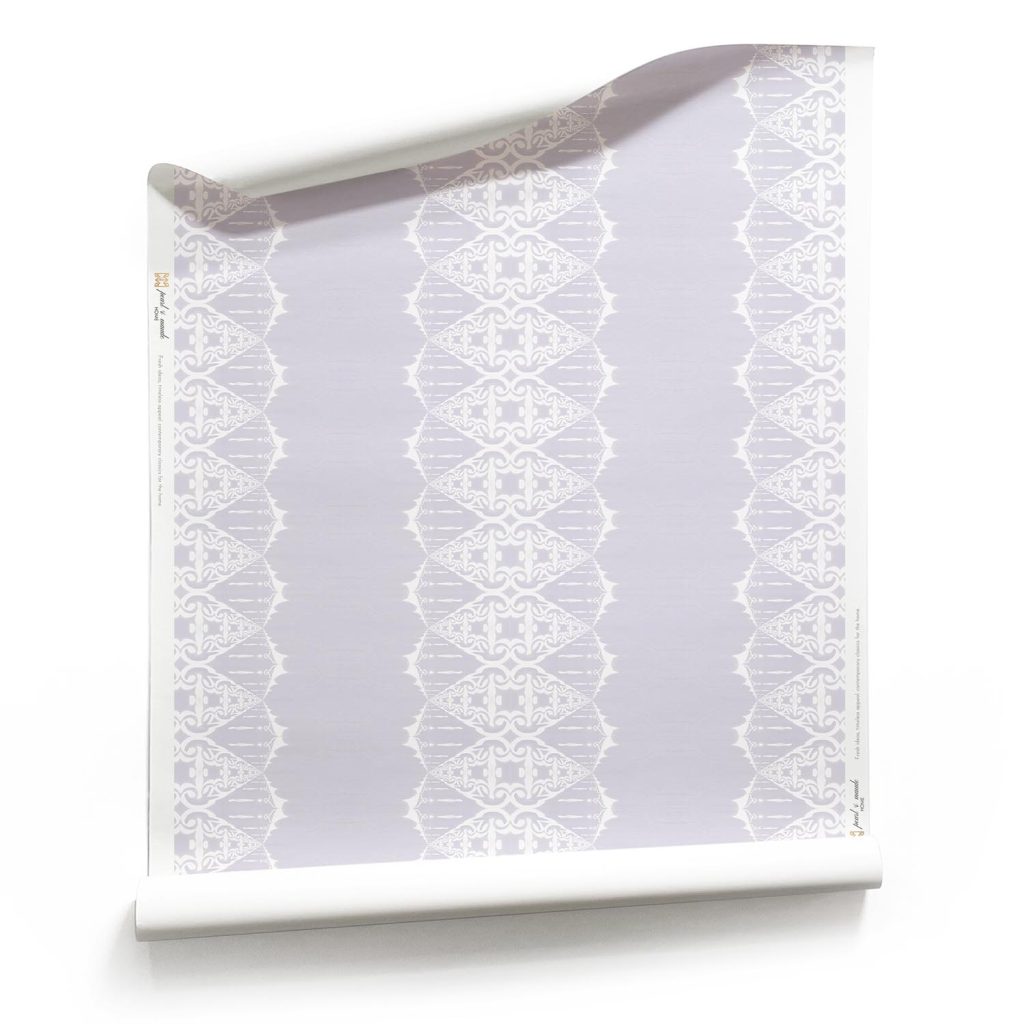 a roll of Elizabeth pale lilac wallpaper with ornate white stripe pattern. by Pearl & Maude