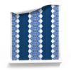 A roll of Lou Striped Navy Blue Wallpaper on a white background- sustainable artisan wallpaper with a nautical stripe theme. _Pearl and Maude. Lou Navy Blue Stripe Wallpaper Roll