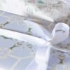Arachne-Blue-Wrapped-Presents-Blue-COlors_Pearl-and-Maude__square_72 A gift wrapped with Arachne periwinkle chinoiserie gift wrap