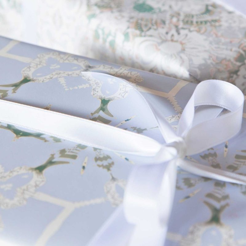 A gift wrapped with Arachne periwinkle chinoiserie gift wrap