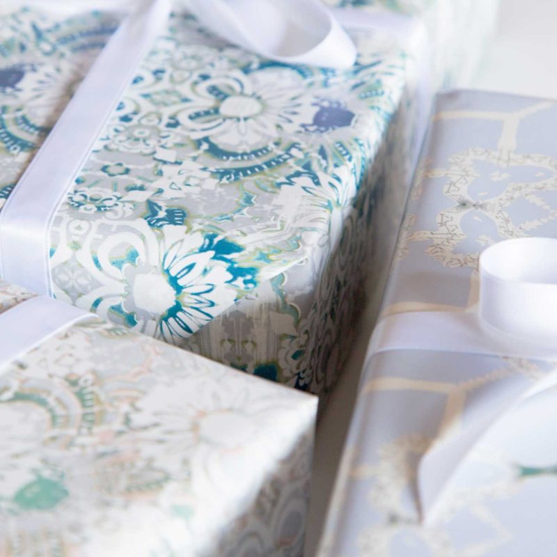 A gift wrapped with Carmen blue floral wrapping paper