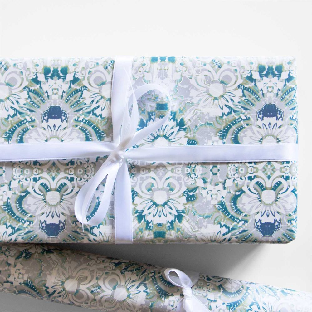 Carmen blue floral wrapping paper on a gift and in a roll
