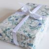 Carmen-Blue-Wrapping-Paper-for-Gifts_Pearl-and-Maude_square_72 A gift wrapped in Carmen blue floral wrapping paper