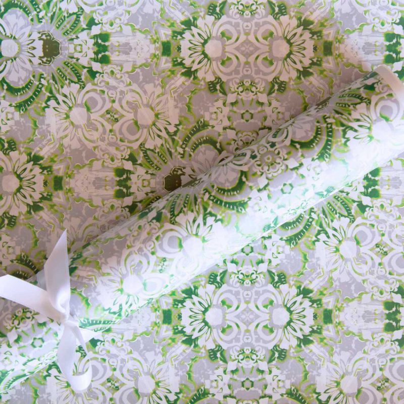 a roll of Carmen wrapping paper in green and white foliage pattern