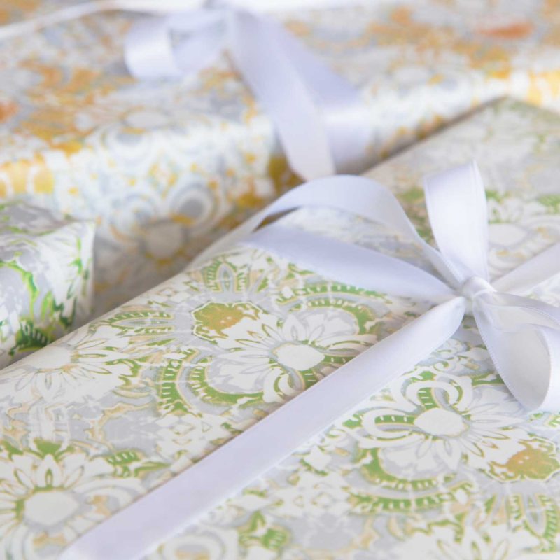 Gifts wrapped with Carmen lime green floral wrapping paper