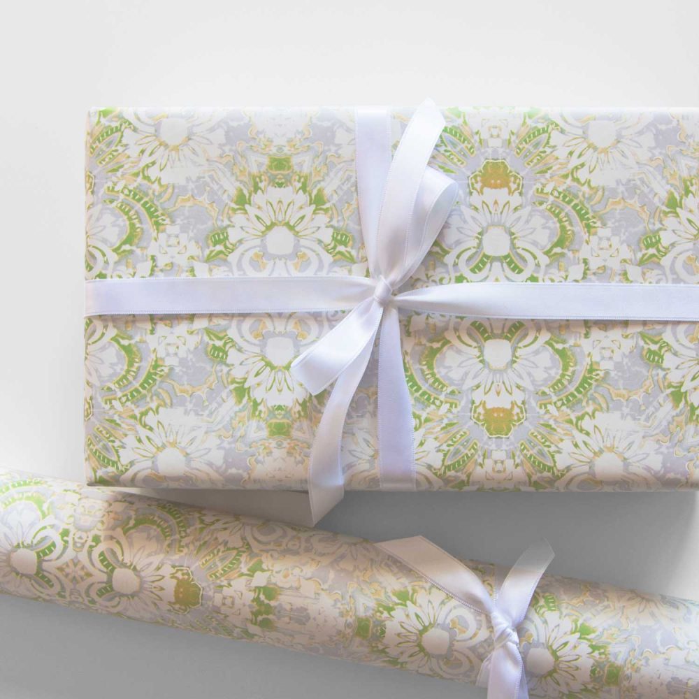 Carmen lime green floral wrapping paper on a gift and in a roll