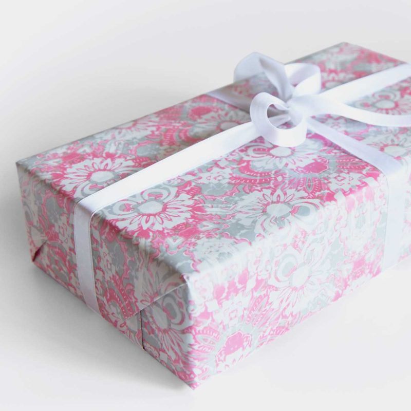 Carmen pink foliage gift wrapping paper on a gift