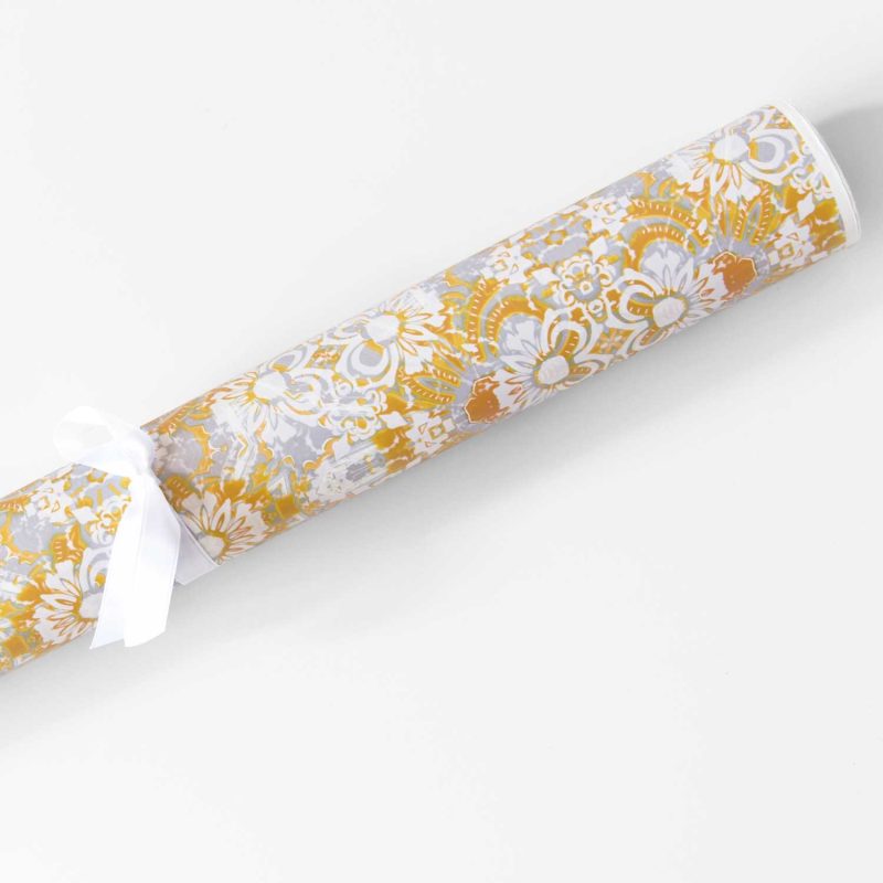 a roll of Carmen yellow floral gift wrapping paper