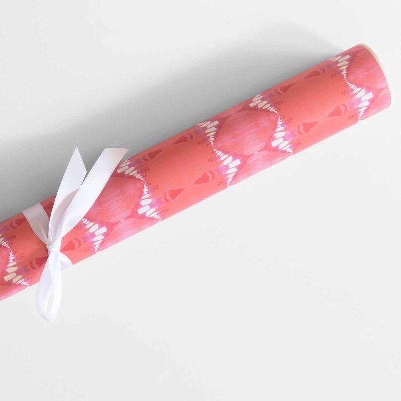 a roll of Evelyn melon red striped wrapping paper